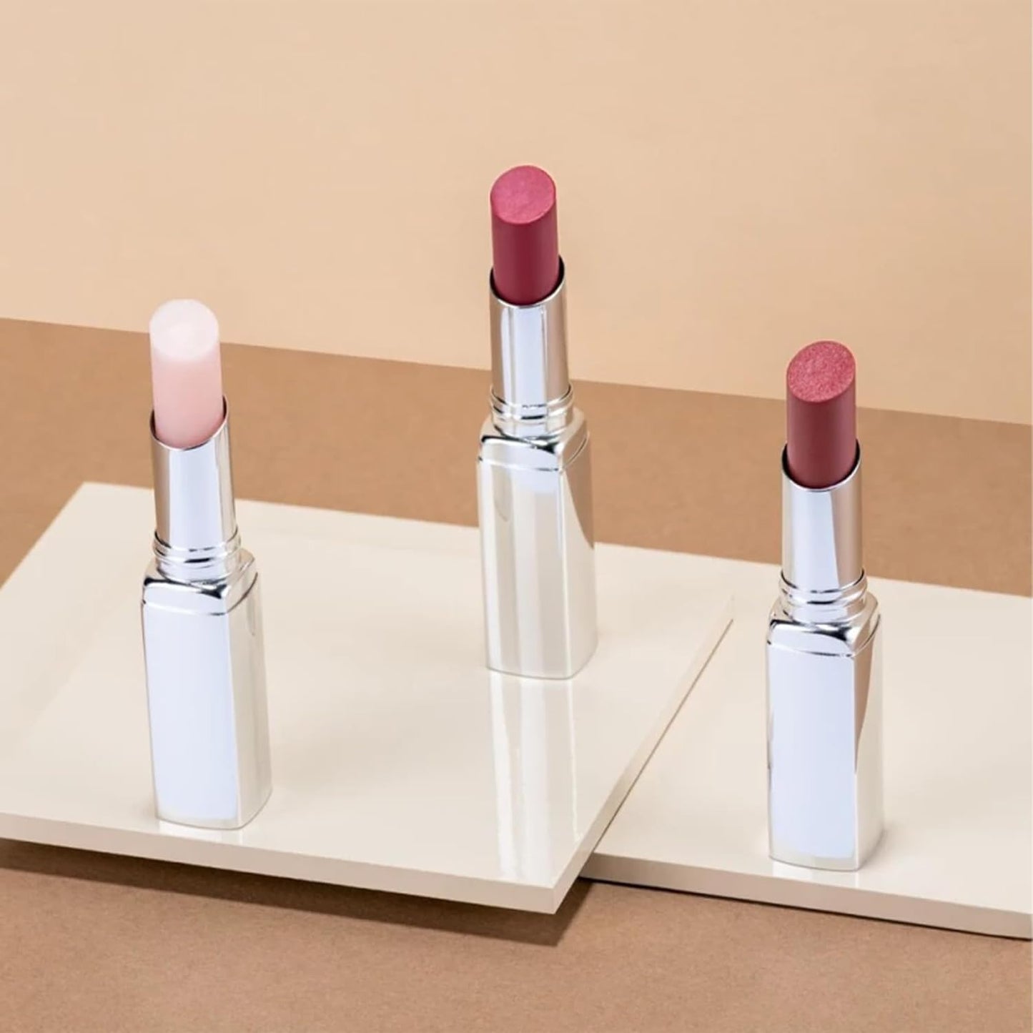 ARTDECO Color Booster Lip Balm in coral - nourishing lip balm with color-adapting pigments - lip plumper with spearmint flavor - prevents dryness & chapping - lip care with kernel oil - 0.1 Oz